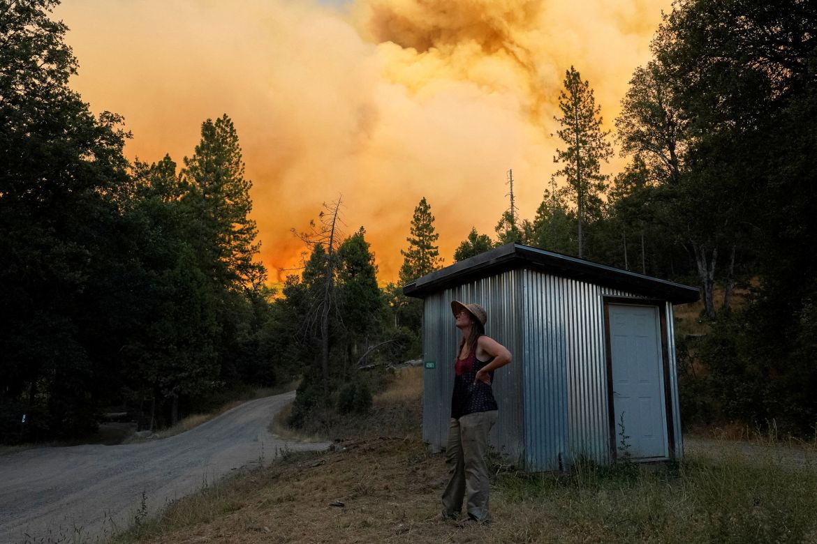 Allison Baggett watches the Oak Fire burn close to her Mariposa