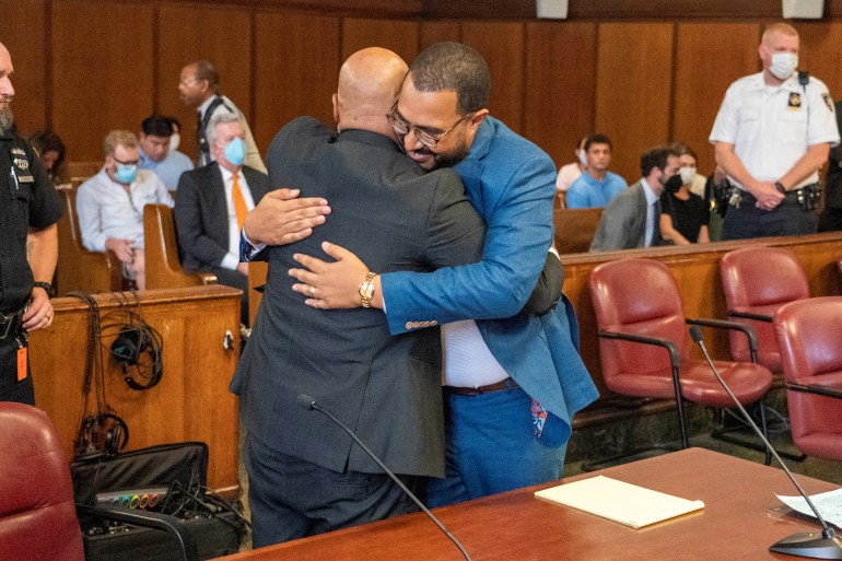 Steven Lopez embracing his lawyer in court.