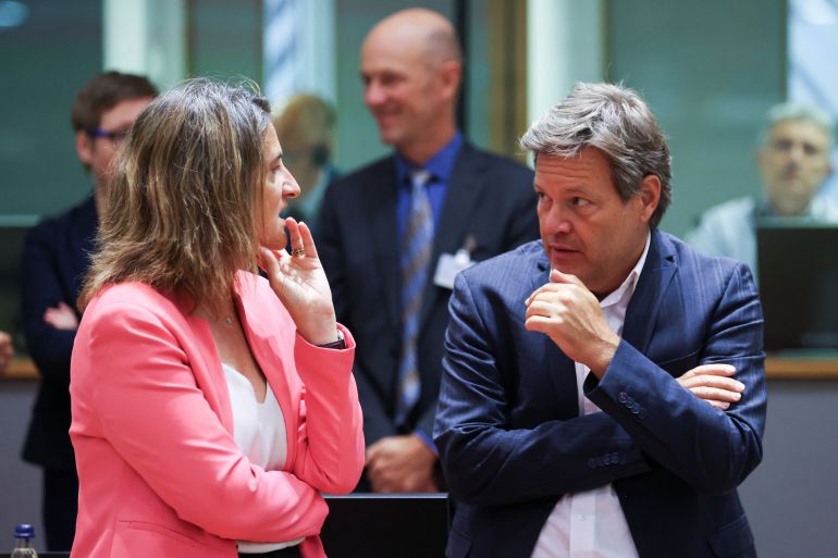Spanish Minister for the Ecological Transition Teresa Ribera speaks with German Vice Chancellor and Minister for Economic Affairs and Climate Action Robert Habeck as they take part in an extraordinary meeting of European Union energy ministers in Brussels