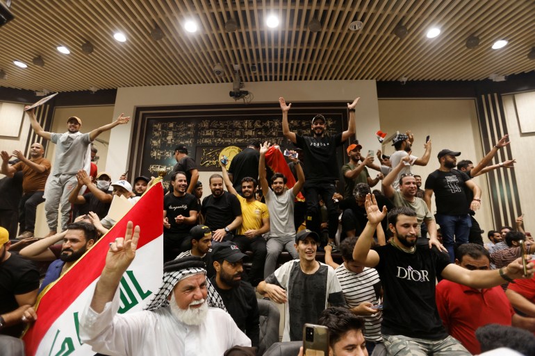 Supporters of Iraqi Shia cleric Moqtada al-Sadr protest against corruption inside the parliament building in Baghdad