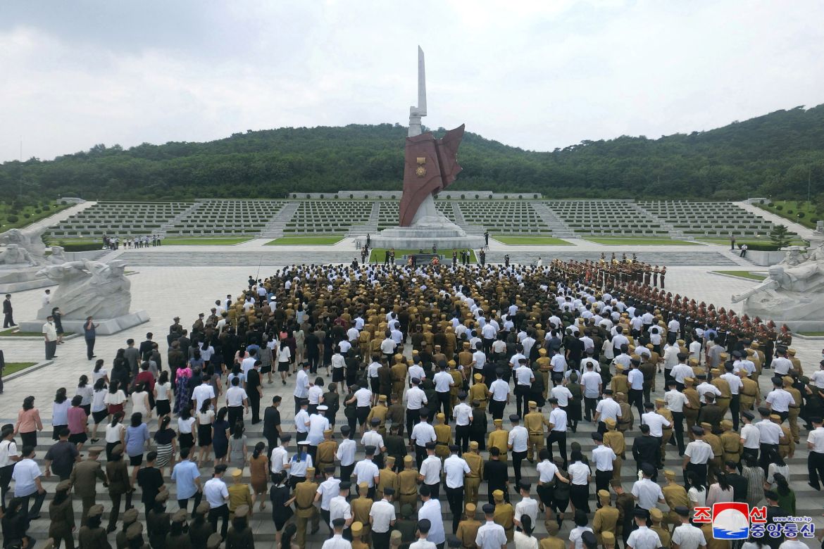People and veterans take part in a a ceremony to mark the 69th anniversary of the Korean War armistice, in Pyongyang