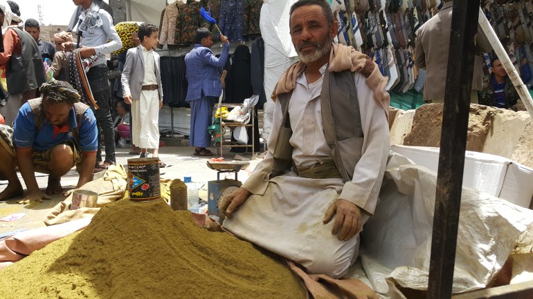 A Yemeni man sells henna