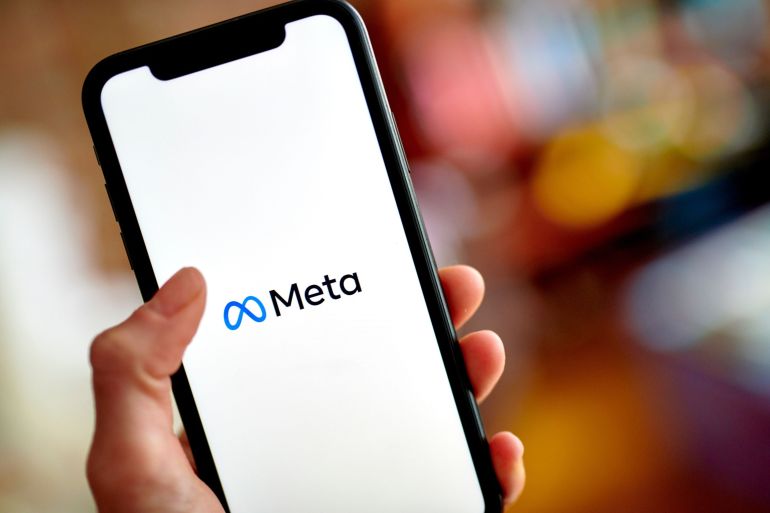 The Meta logo on a smartphone.