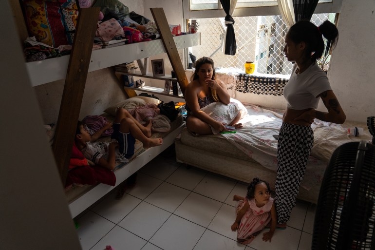 A family inside of their home in 9 de Julho