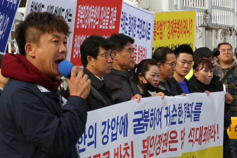 North Korean defectors stage a rally denouncing the deportation of North Korean fishermen in front of the government complex in Seoul, South Korea, November 12, 2019.