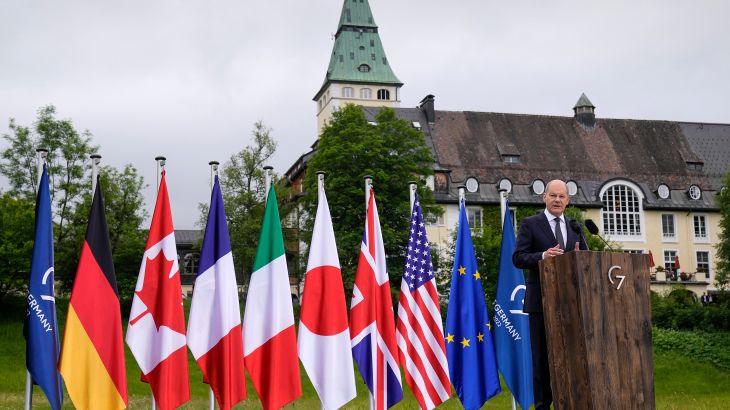 German chancellor with flags of the G7