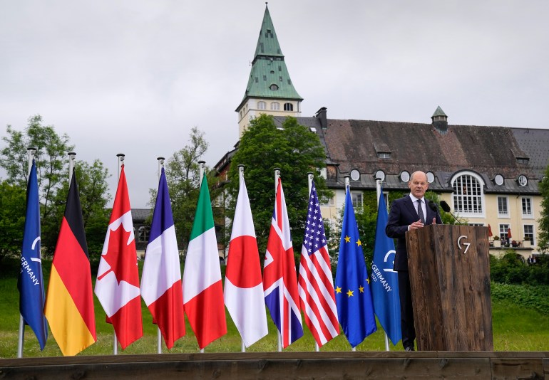 Canciller alemán con banderas del G7