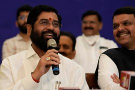 Rebel Shiv Sena leader Eknath Shinde, left, addresses a news conference with the BJP&#39;s Devendra Fadnavis after claiming the majority to form the Maharashtra state government, in Mumbai [Rajanish Kakade/AP]