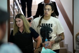 WNBA star and two-time Olympic gold medallist Brittney Griner is escorted to a courtroom at the beginning of her trial in Moscow, Russia [Alexander Zemlianichenko/The Associated Press]