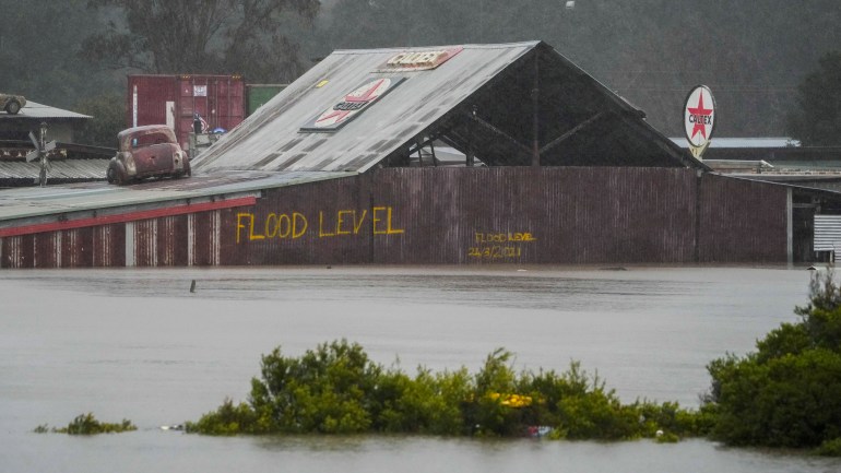 Flood waters surround an industrial property in Londonderry on the outskirts of Sydney, Australia, Monday, July 4, 2022. More than 30,000 residents of Sydney and its surrounds have been told to evacuate or prepare to abandon their homes on Monday as Australia's largest city braces for what could be its worst flooding in 18 months.  (AP Photo / Mark Baker)