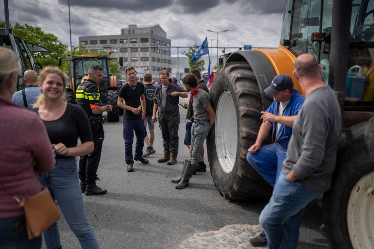 Some 25 tractors parked outside a distribution center for supermarket chain Albert Heijn during a blockade in the town of Zaandam
