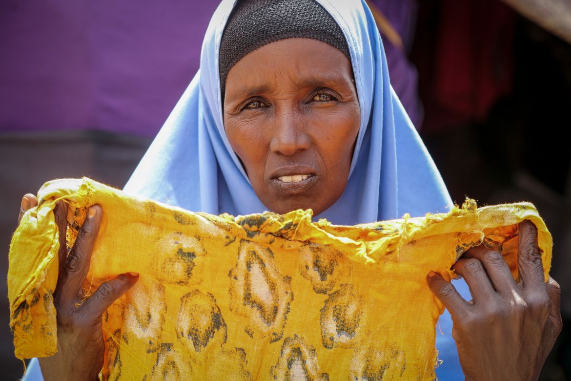 Hawa Osman Bilal shows the clothes of her daughter Ifrah