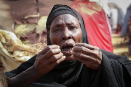 Dhahabo Isse, 60, describes how she fled from the drought without food or water, causing four of her children to die of hunger, outside her makeshift tent at a camp for the displaced on the outskirts of Mogadishu. [Farah Abdi Warsameh/AP Photo]