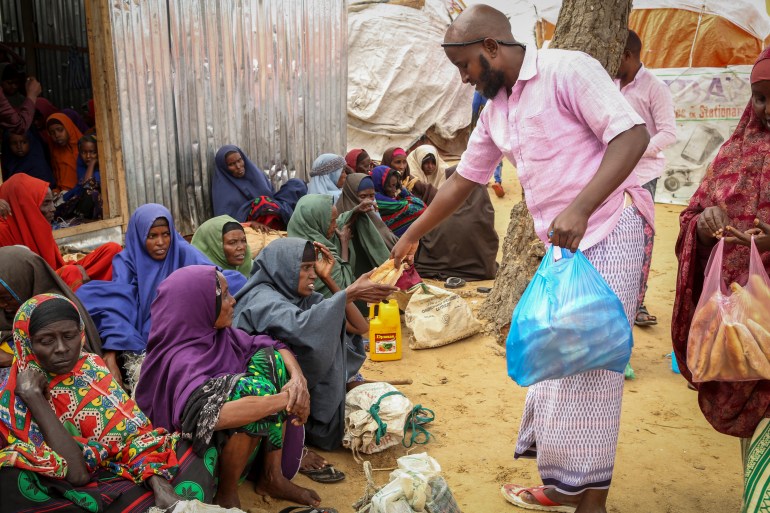 Somalis who fled drought-stricken areas receive charitable food donations from city residents