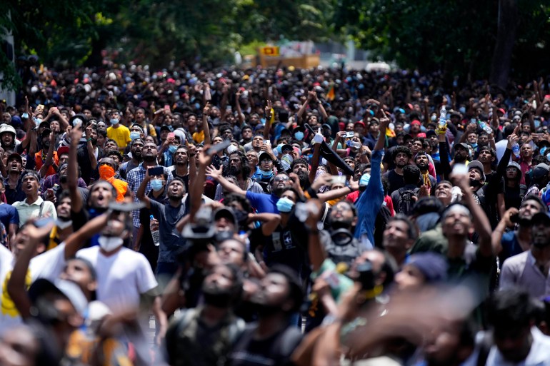 Protesters gather to storm the Sri Lankan Prime Minister Ranil Wickremesinghe's office.