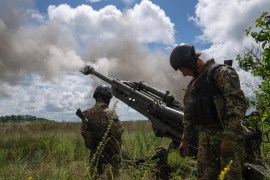 Ukrainian servicemen fire at Russian positions from a US-supplied M777 howitzer in the Kharkiv region [Evgeniy Maloletka/AP Photo]