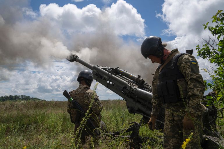 Ukrainian servicemen fire at Russian positions from a US- supplied M777 howitzer in Kharkiv region, Ukraine