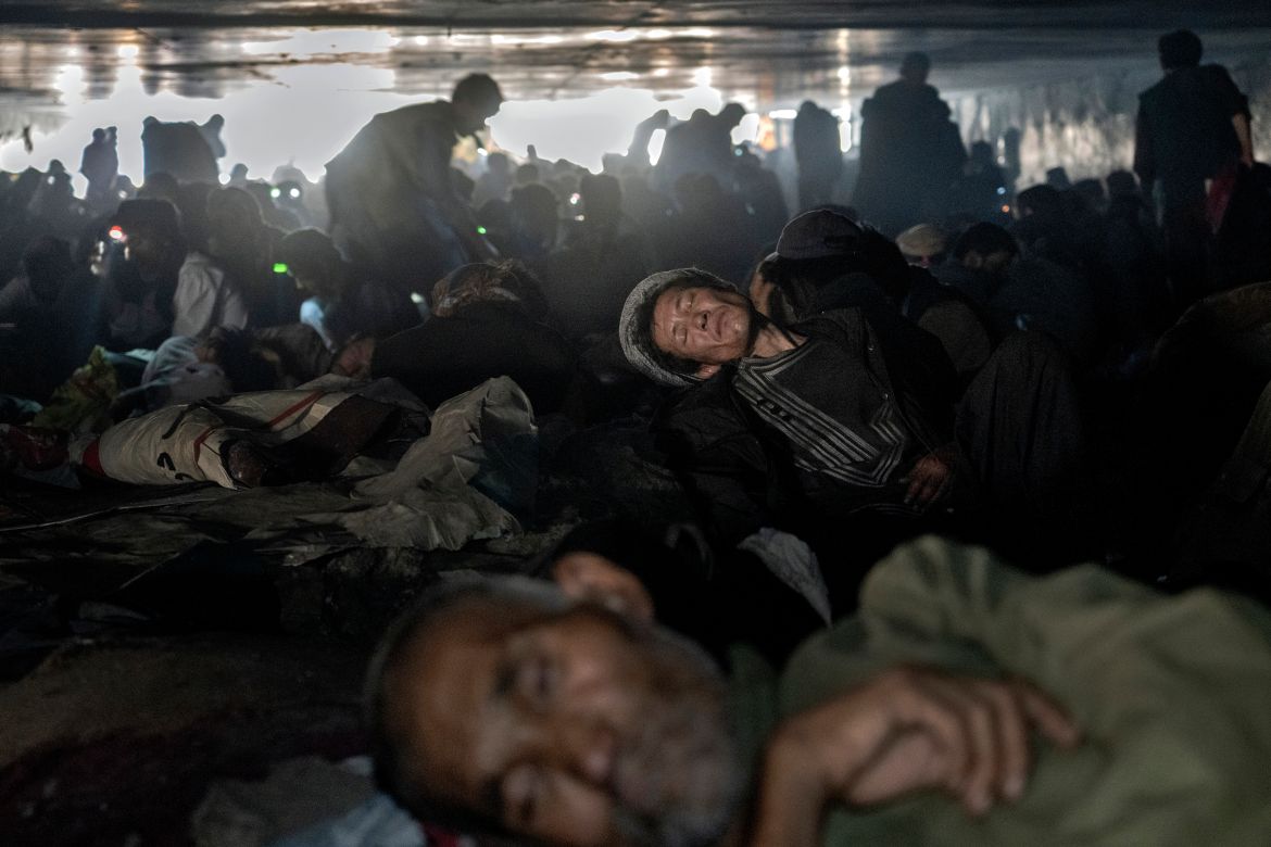 Hundreds of Afghans addicts gather under a bridge to consume drugs, mostly heroin and metha