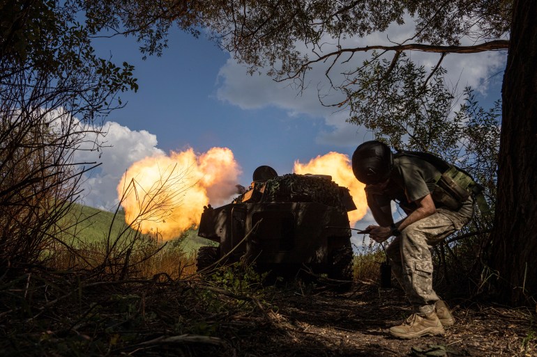 Ukrainian self-propelled artillery shoots towards Russian forces at a frontline in Kharkiv region