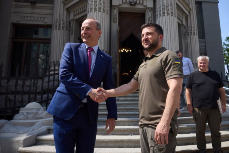 Ukraine's President Volodymyr Zelenskyy welcomes Ireland's Prime Minister Micheal Martin before a meeting in Kyiv.