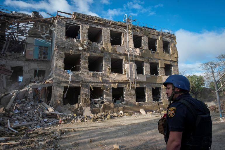 A rescuer stands in a front of a school building destroyed by a Russian missile strike, in Kramatorsk, Ukraine July 21, 2022