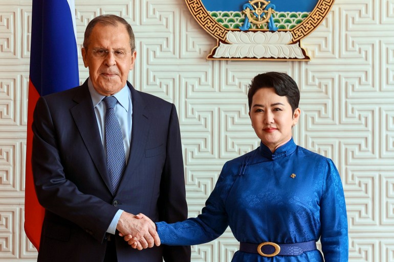 Mongolian Foreign Minister Batmunkh Battsetseg shakes hands with Russian Foreign Minister Sergey Lavrov prior to their talks in Ulaanbaatar, Mongolia, Tuesday, July 5, 2022 