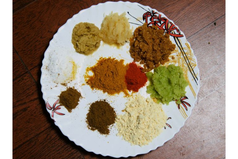 Majid Bhai set out his aromatic pastes and spices, ready to cook