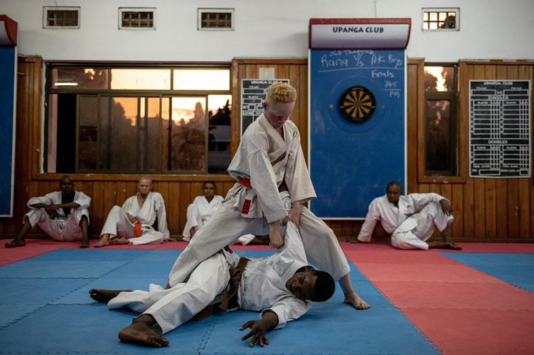 Hassan Farahani, 29, practices a karate takedown on a fellow student during training in Nairobi, Kenya