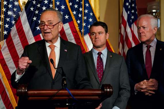 U.S. Senate Majority Leader Chuck Schumer (D-NY) speaks as U.S. Senators Todd Young (R-IN) and John Cornyn (R-TX) listen during a news conference after the U.S. Senate passed legislation to subsidize the domestic semiconductor industry, at the U.S. Capitol in Washington, US