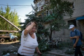 A woman reacts after the Russian shelling in city centre in Sloviansk, Ukraine, June 27, 2022 [File: Efrem Lukatsky/AP Photo]