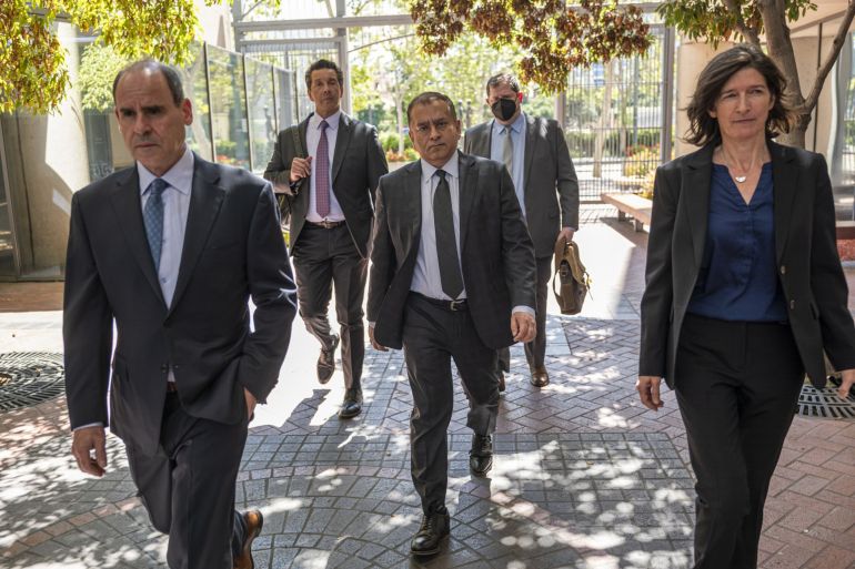 Sunny Balwani, former president of Theranos Inc., center, arrives at federal court in San Jose, California, US