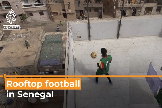Young Senegalese footballers train on roofs