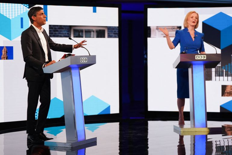 Rishi Sunak and Liz Truss are seen taking part in a televised debate