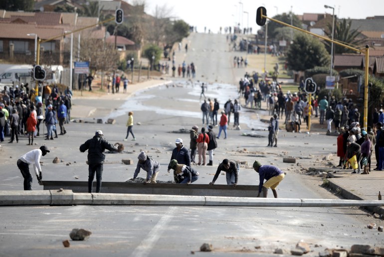 Protesters build a barricade in Tembisa township