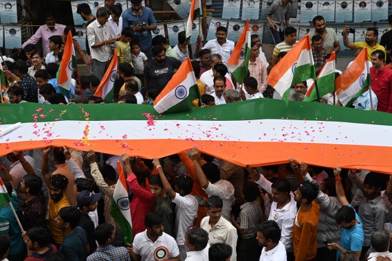 People carry the Indian national flag as they celebrate ahead of country's 75th Independence Day, in Chennai