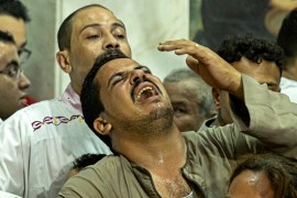 Egyptian mourners at the church of the Blessed Virgin Mary in Giza react during the funeral of victims killed in the fire [Khaled Desouki/AFP]