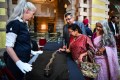 Guests look at a ceremonial Indo-Persian sword