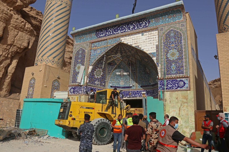Iraqi rescue workers search for survivors under shrine