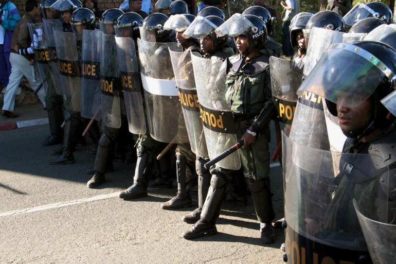 Riot police stand guard in Madagscar