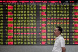 An investor stands in front of an electronic board at a stock exchange in Shanghai July 5, 2007. China&#39;s main stock index closed down more than 5 percent on Thursday, led by large-caps such as Bank of Communications, hit by a rising number of new share issues and the government&#39;s plan to issue 1.55 trillion yuan ($200bn) in special treasury bonds [Aly Song/Reuters]
