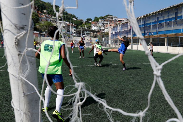 Children from different countries play football during a friendly match ahead of the Street Child World Cup at the Vidigal slum in Rio de Janeiro, Brazil.