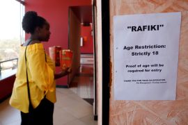 A woman enters a screening of the Kenyan movie Rafiki