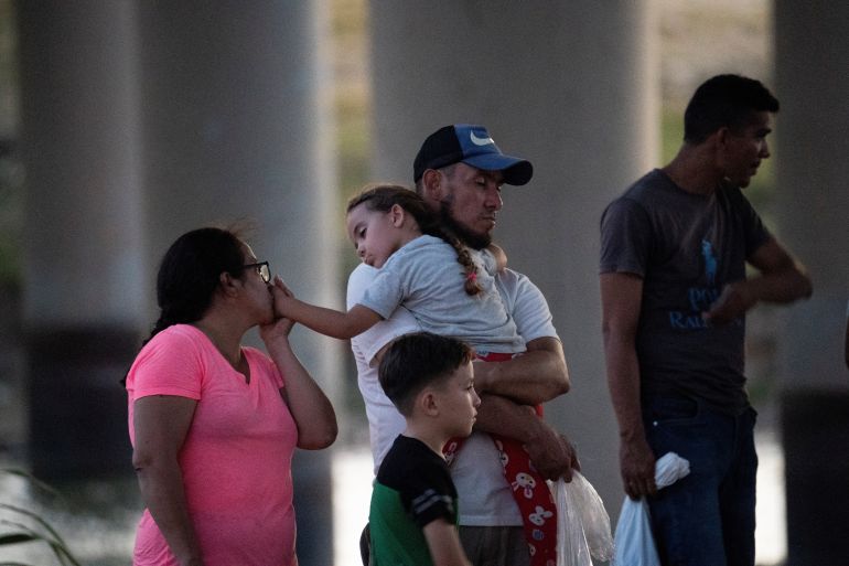 Asylum seekers are seen at the US-Mexico border