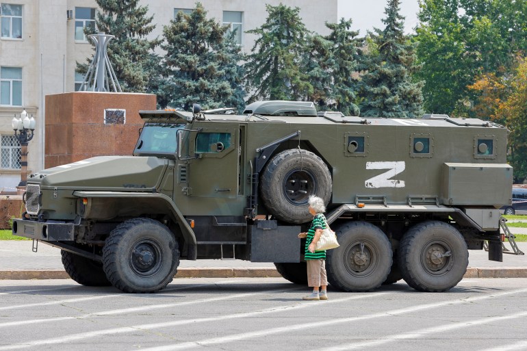 An armoured truck of pro-Russian troops is parked near Ukraine's former regional council's building during Ukraine-Russia conflict in the Russia-controlled city of Kherson, Ukraine July 25, 2022. REUTERS/Alexander Ermochenko