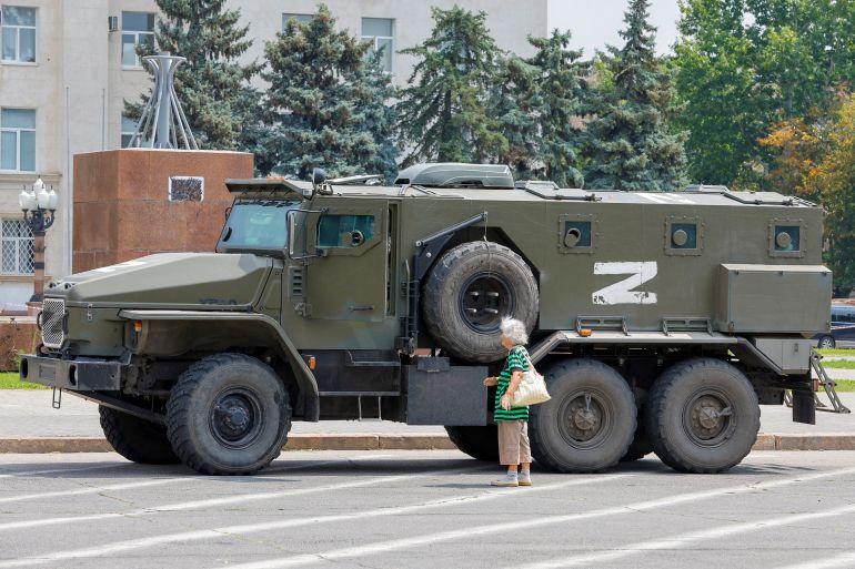 An armoured truck of pro-Russian troops is parked near Ukraine's former regional council's building during Ukraine-Russia conflict in the Russia-controlled city of Kherson, Ukraine July 25, 2022. REUTERS/Alexander Ermochenko