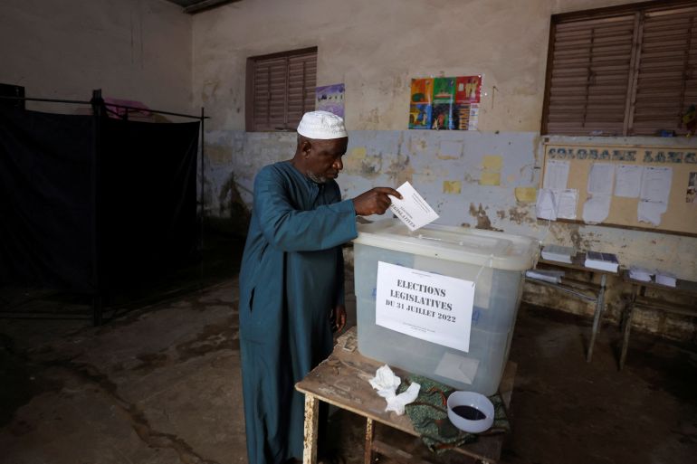 A man casts his ballot during the parliamentary election, in Pikine, on the outskirts of Dakar, Senegal.
