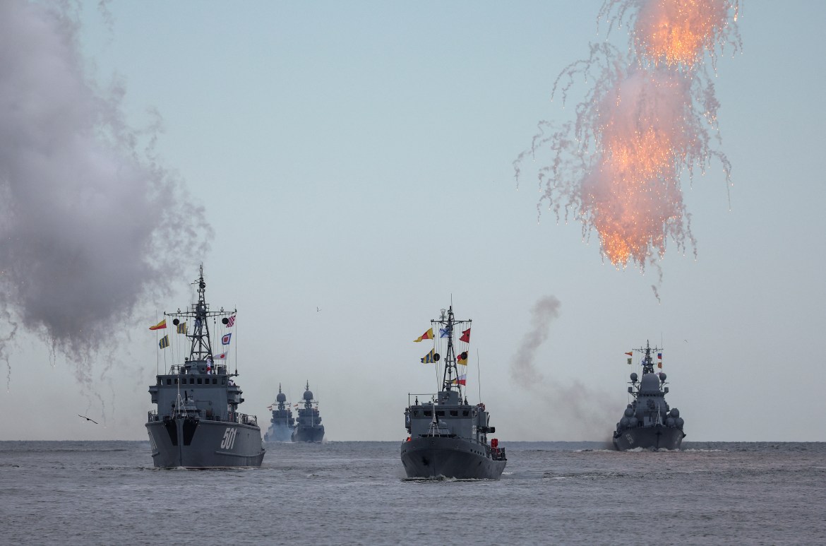 Russian warships sail during a parade marking Navy Day in Baltiysk in the Kaliningrad region