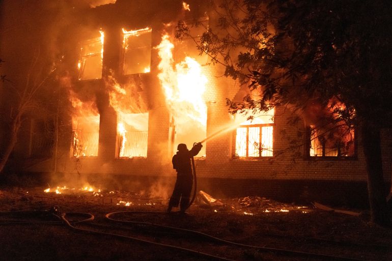A firefighter extinguishes a burning hospital building hit by a Russian missile strike, as Russia's attack on Ukraine continues, in Mykolaiv, Ukraine August 1,
