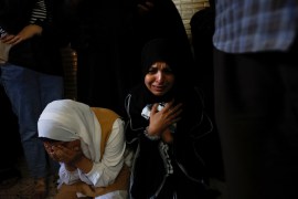 Mourners attend the funeral of Palestinian Dirar Al-Kafrini who was killed by Israeli forces