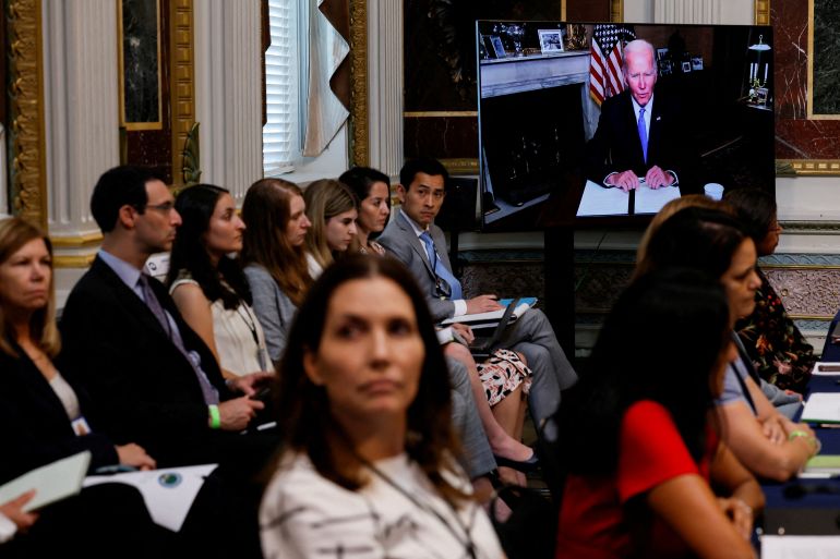 U.S. White House staff watch as U.S. President Joe Biden delivers remarks at a virtual event on securing access to reproductive and other health care services at the first meeting of the interagency Task Force on Reproductive Healthcare Access in the Indian Treaty Room in the Eisenhower Executive Office Building in Washington, U.S.